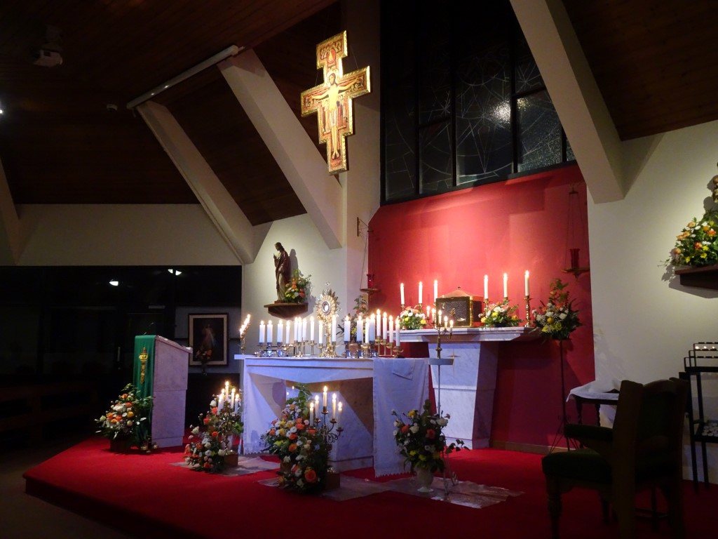 The altar and sanctuary at St Clare's, decorated for Adoration